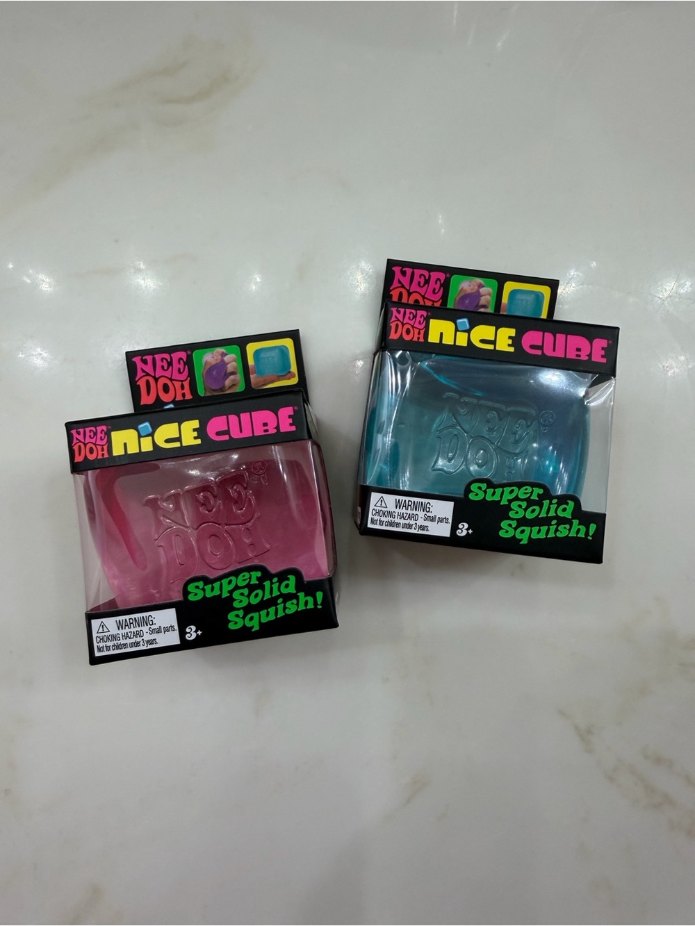 NeeDoh Nice Cube Super Solid Squish Toy - 2 Pack Bundle. Blue, Pink
